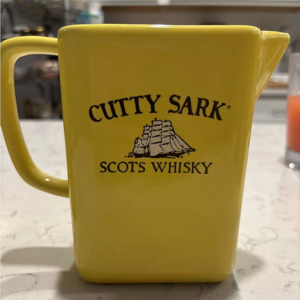 Curry Sark vintage yellow Whiskey pitcher no chips or breaks.